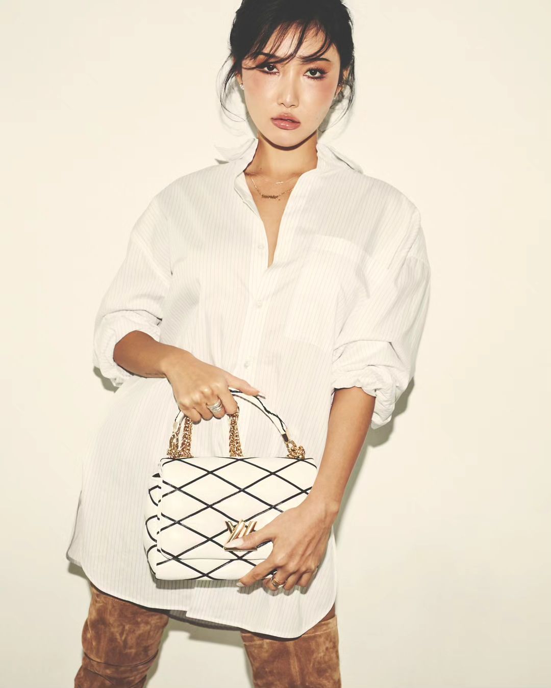 HWASA is seen with the GO-14 bag