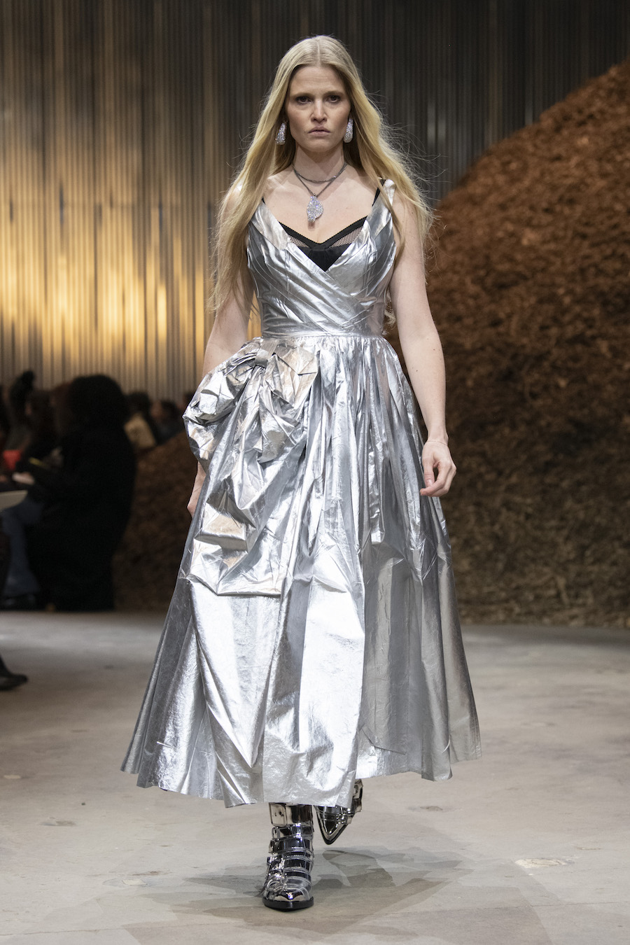 Lara Stone wears a bow embellished Alexander McQueen dress in the fall winter 2022 collection