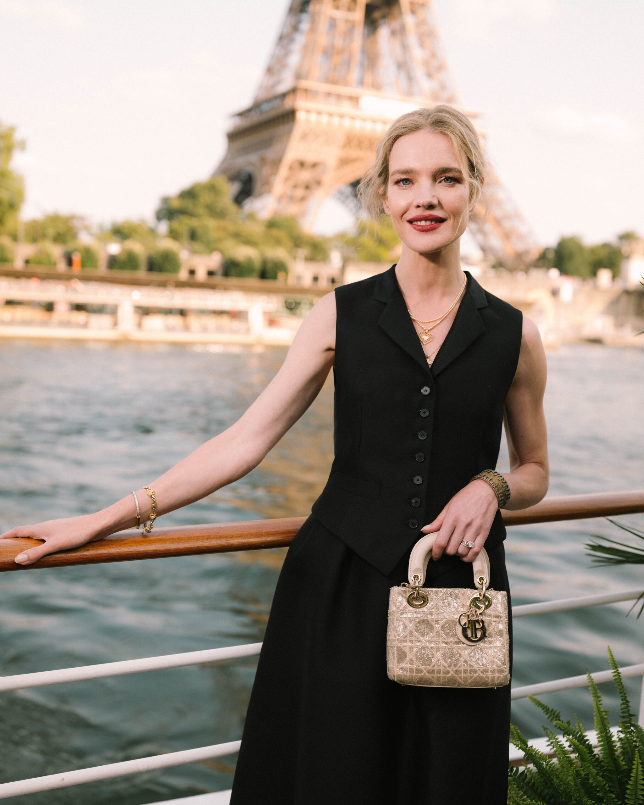 Natalia Vodianova in Dior Haute Couture Natalia Vodianova showcased timeless elegance in a menswear-inspired waistcoat from Dior Haute Couture. She paired it with a black wool Miss Dior skirt and carried a Dior bag.