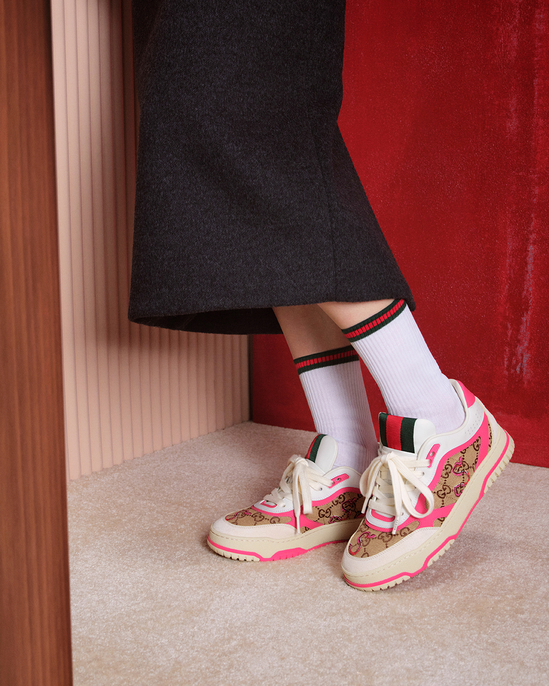 The Gucci Re-Web sneakers in beige and pink GG canvas, paired with signature Web-striped socks. (Image: Courtesy of Gucci)