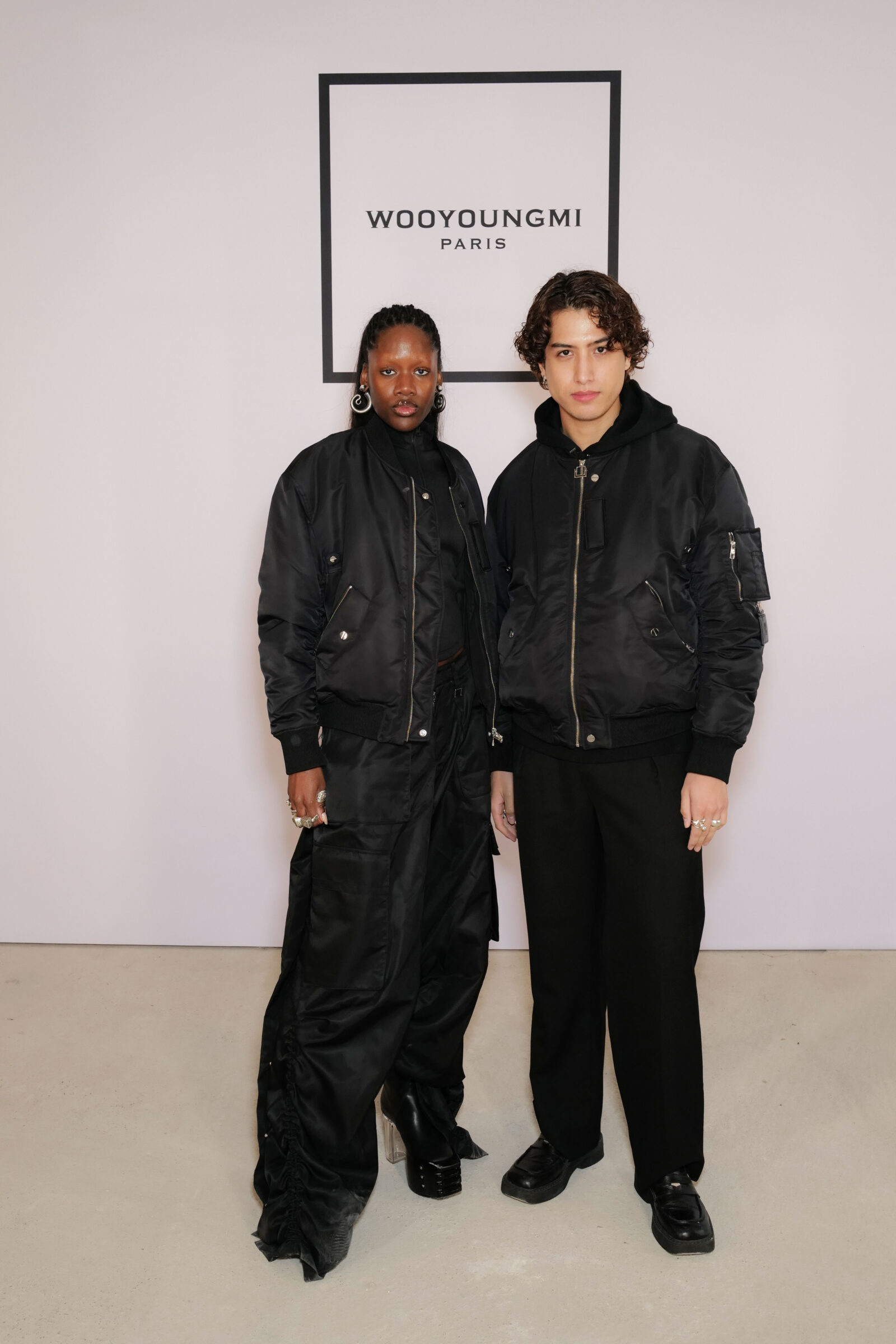 Oyinda and Kemio, fashionable guests at the Wooyoungmi FW24 show. Oyinda and Kemio, fashionable guests at the Wooyoungmi FW24 show.