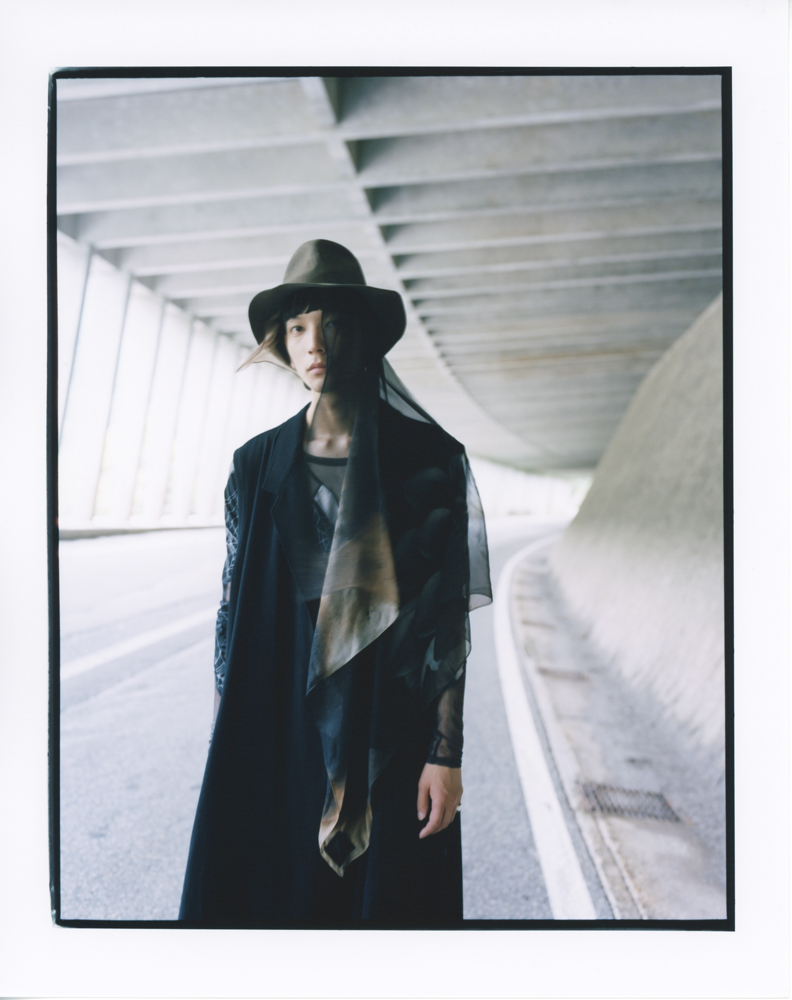 Coat, top, pants, and hat by YOHJI YAMAMOTO