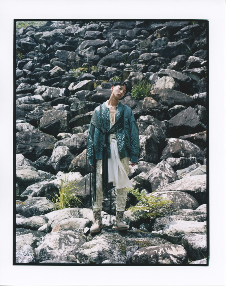 Jacket, shirt, and pants by FACETASM, shirt by SASQUATCHFABRIX, boots by SACAI