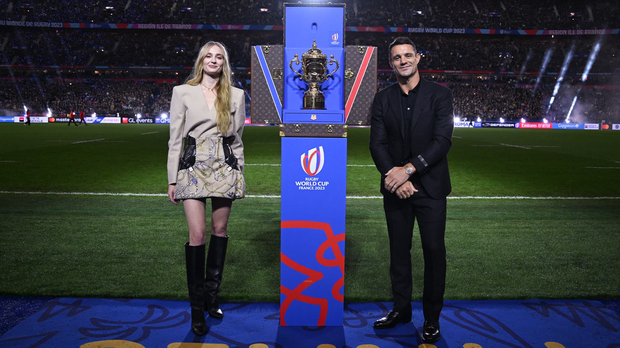 Dan Carter and Sophie Turner Unveil the Webb Ellis Trophy in Louis Vuitton Glory at Rugby World Cup France 2023