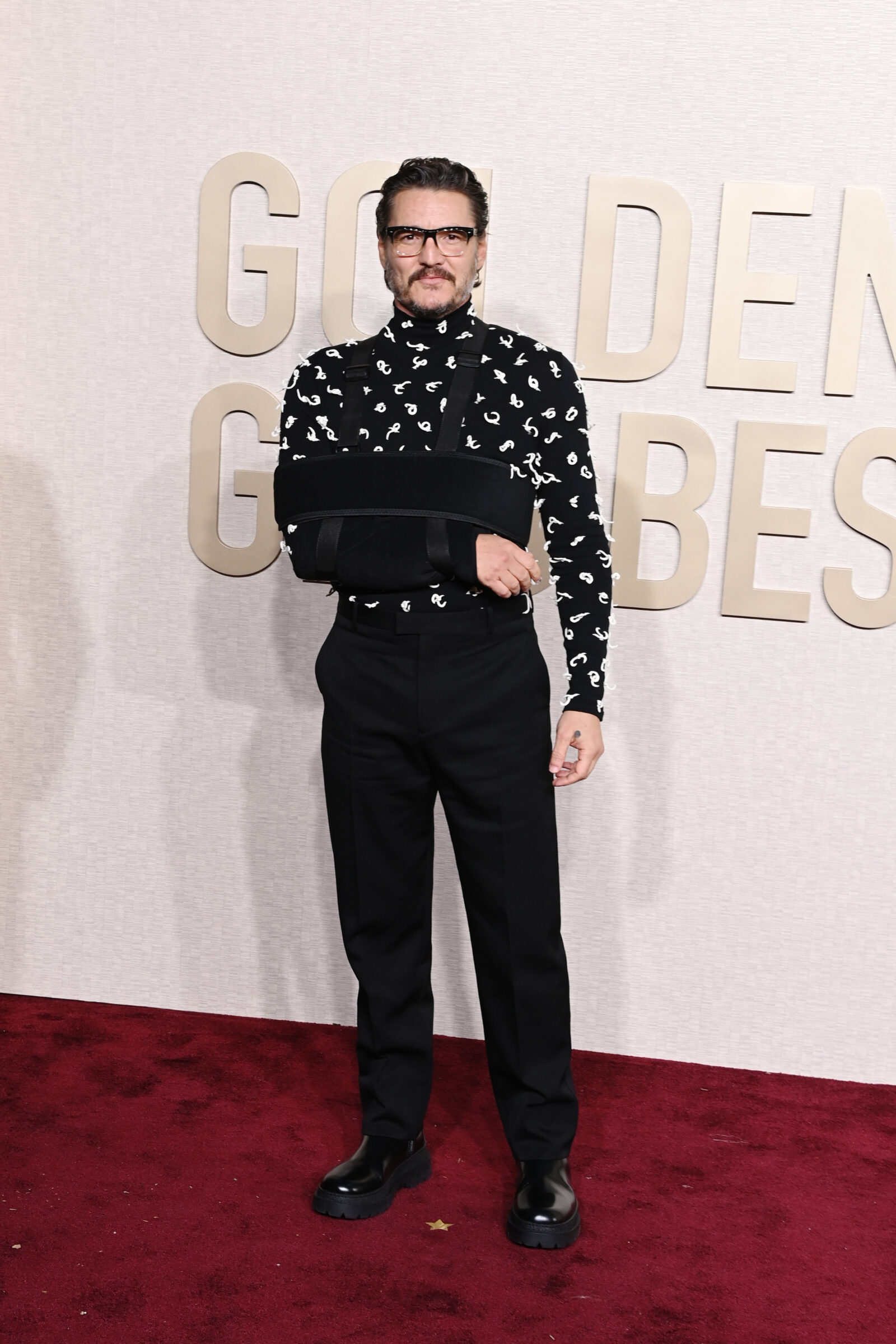 Pedro Pascal defines modern sophistication with Bottega Veneta's contemporary menswear on the Golden Globes red carpet. (Photo by Jon Kopaloff/WireImage,)