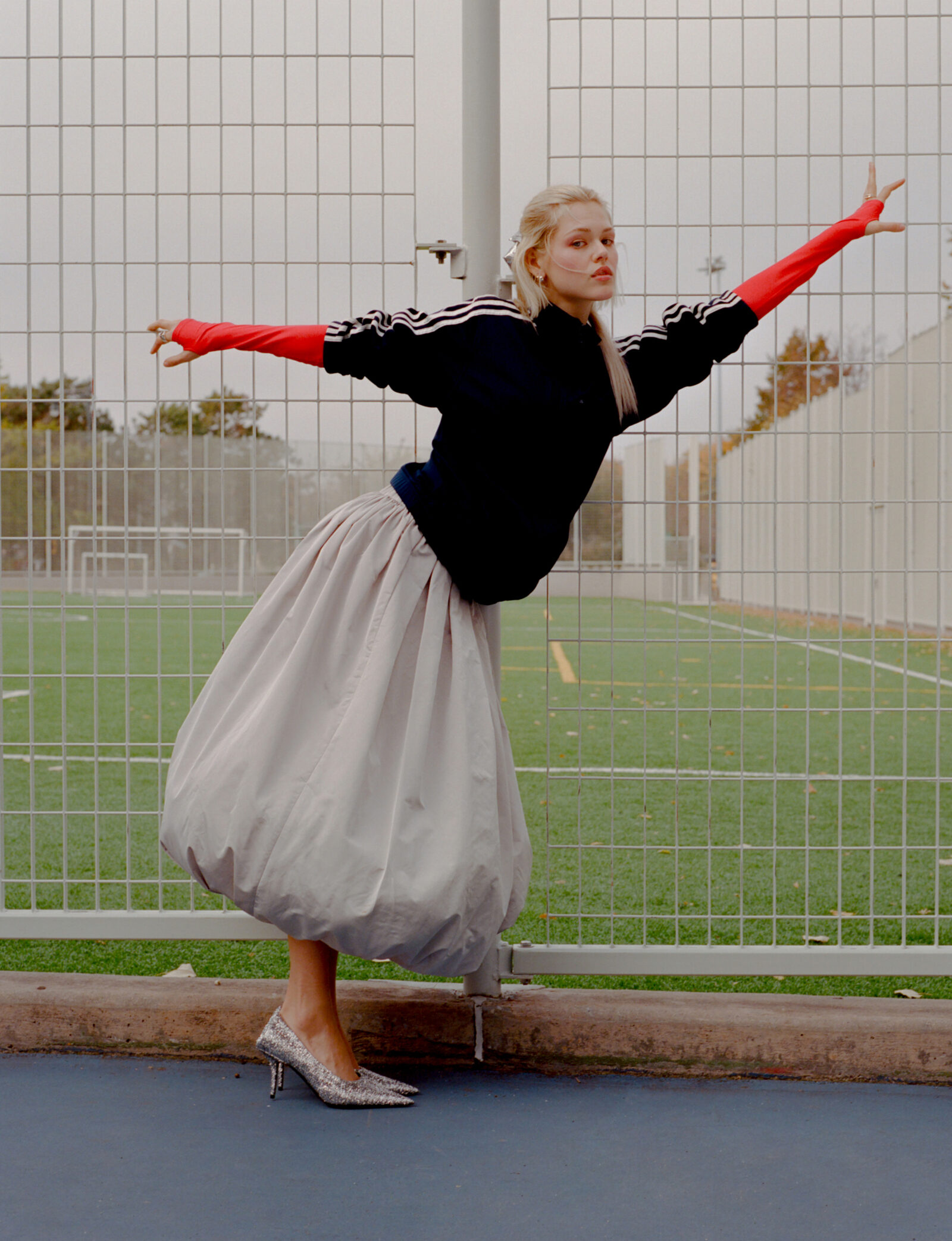 Bow by COMO SI FUERAN DIOSES, jacket, stylist's own, top by SANDY LIANG, skirt by DENIZ BLUMENSTEIN, shoes by BALENCIAGA, jewelry by WOLF CIRCUS.