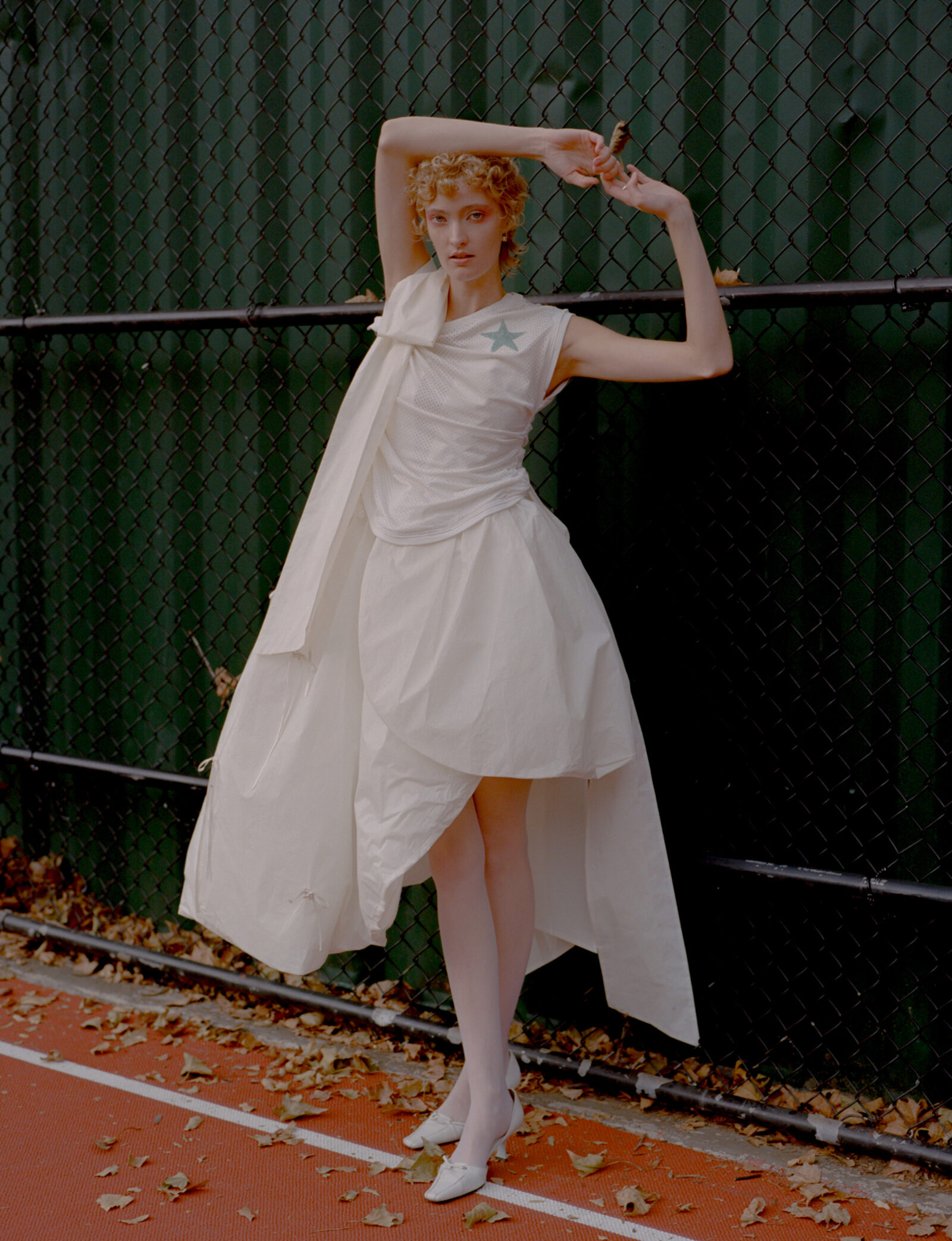 Top by DENIZ BLUMENSTEIN, dress by MERUERT TOLEGAN, shoes, vintage, jewelry by WOLF CIRCUS.