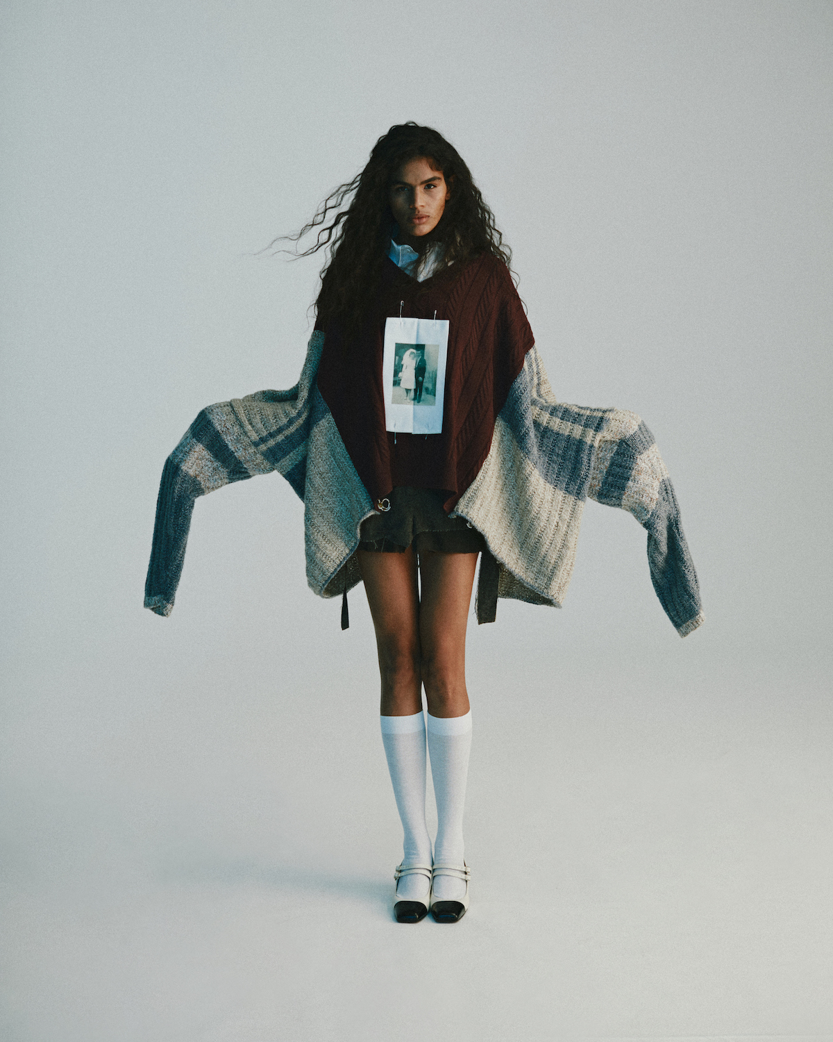 Sweater and skirt by SIMON CRACKER, shirt by ANDREA INCONTRI, shoes by ICEX CHIE MIHARA, socks by MARIA LA ROSA Sweater and skirt by SIMON CRACKER, shirt by ANDREA INCONTRI, shoes by ICEX CHIE MIHARA, socks by MARIA LA ROSA