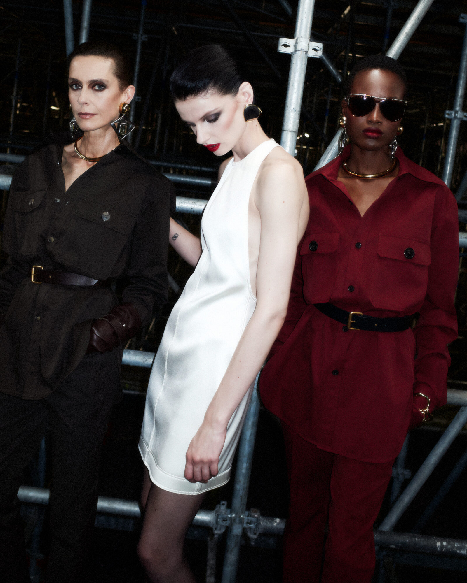 Saint Laurent SS24 captures the essence of sophistication with a bold burgundy ensemble, contrasting sharply against a backdrop of timeless monochromes — a perfect illustration of the season's color story.