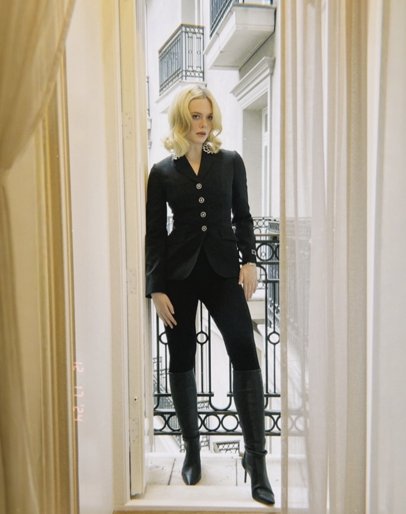 Elle Fanning strikes a pose on a London balcony in VERSACE while on the press tour for "A Complete Unknown" (Photo: IG @ellefanning)