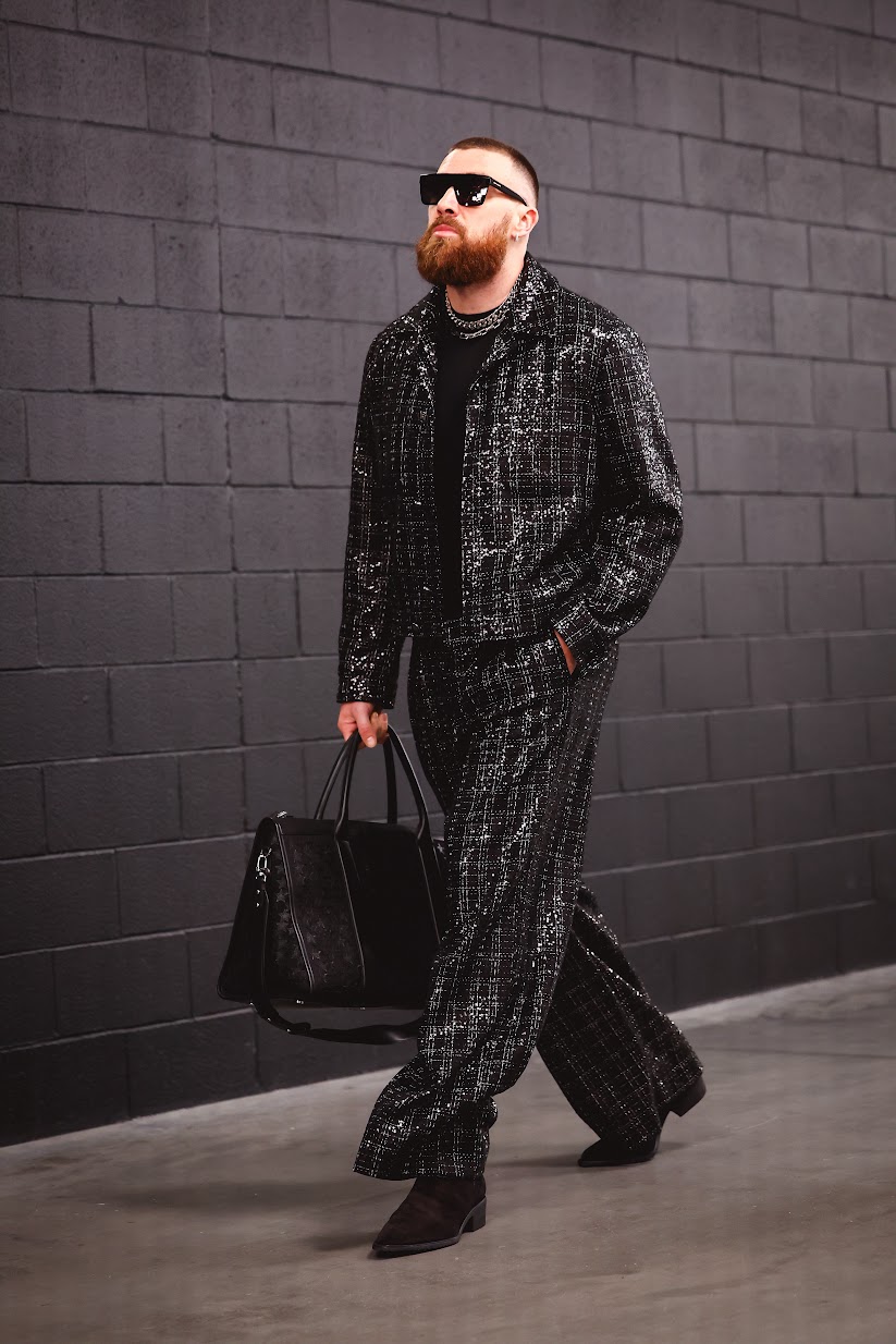 Travis Kelce exudes confidence at Super Bowl LVIII, styled in a bespoke AMIRI ensemble that commands attention as fiercely as his gameplay (Photo courtesy of Kansas City Chiefs).