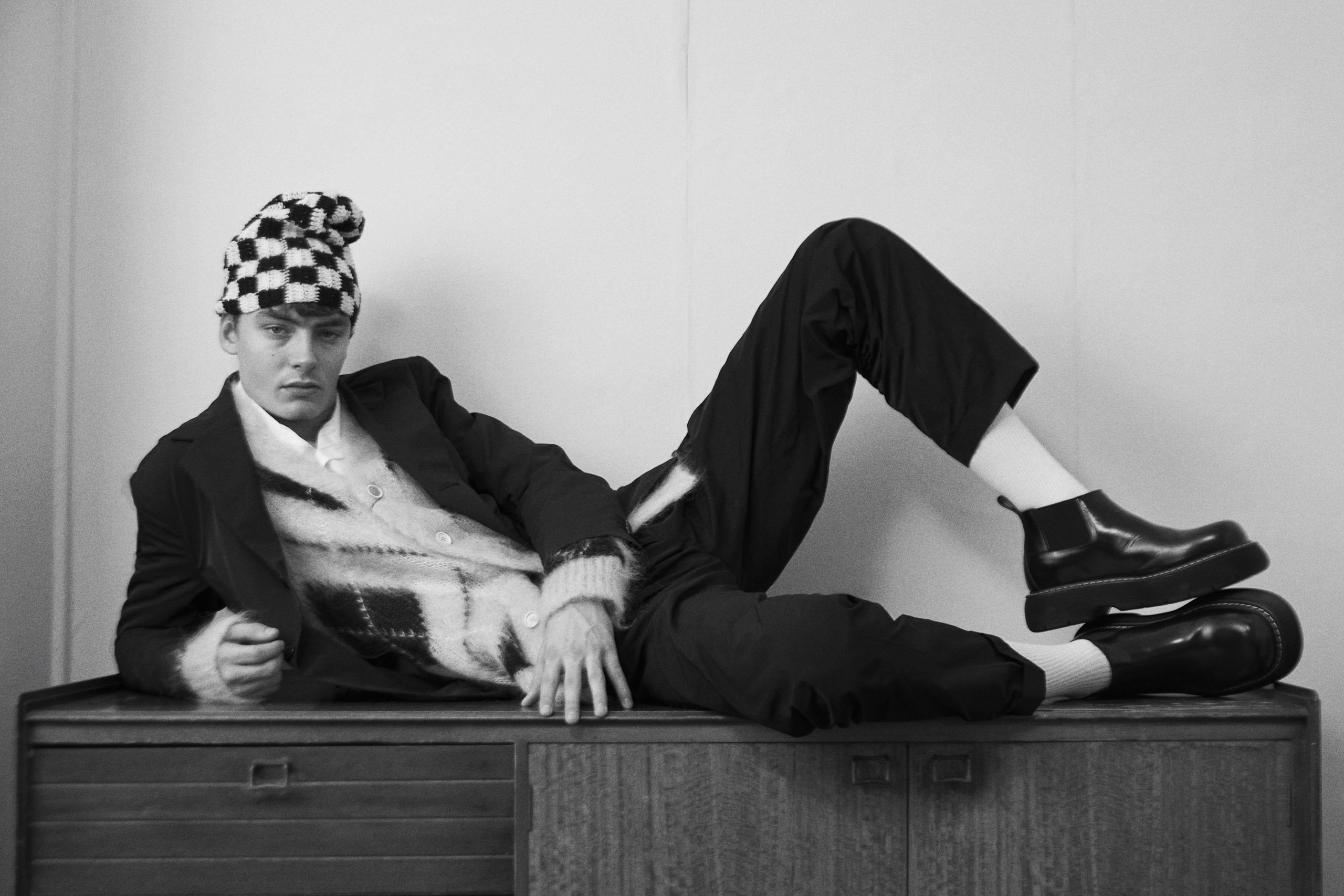 Jacket and trousers by MOLLY GODDARD, shirt by STILL BY HAND, cardigan by MARNI, shoes by BOTTEGA VENETA, hat by SUSSY