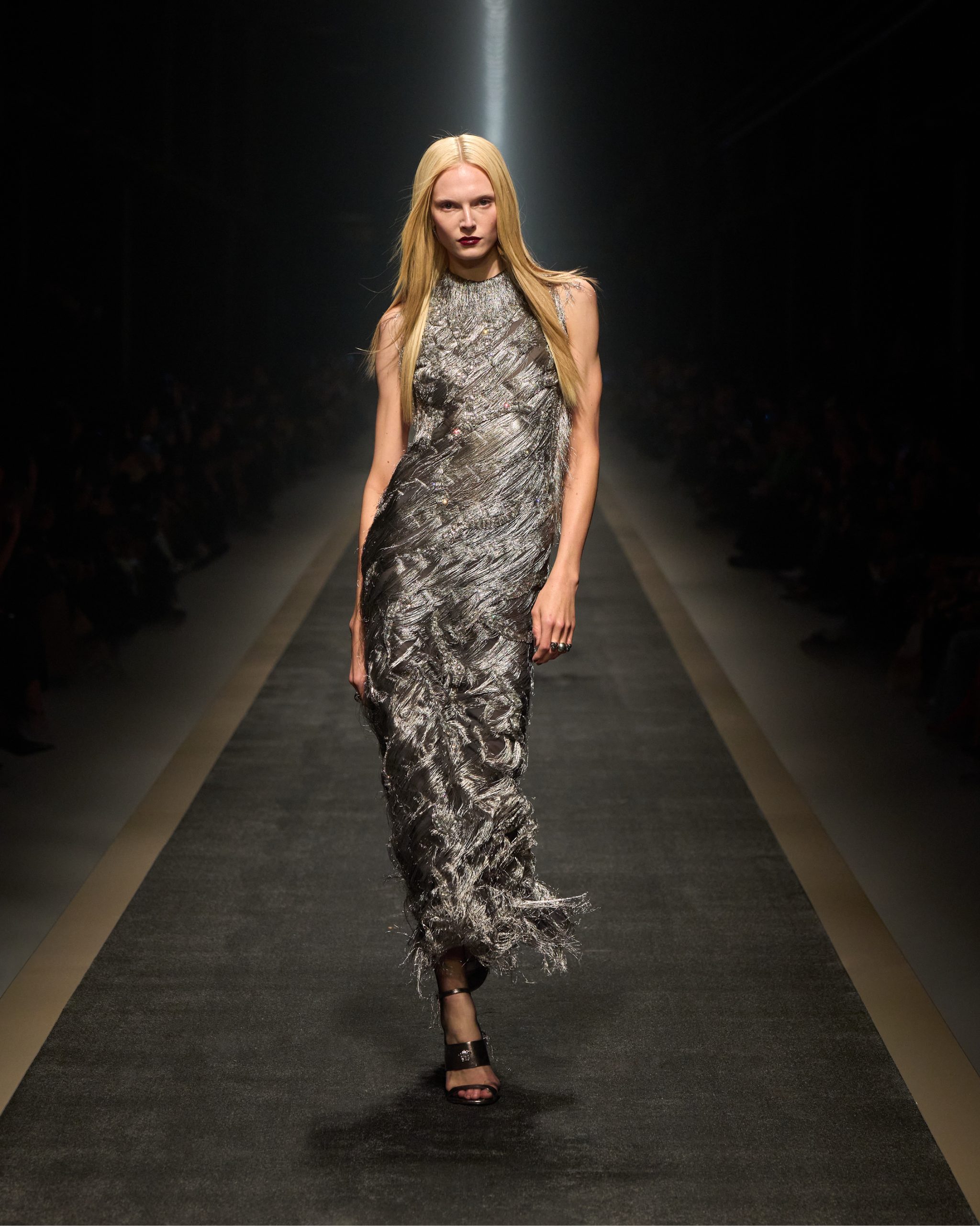 Look 60 FW25 recalls the iconic metallic dress worn by Naomi Campbell from the FW98 collection (Photo courtesy of Versace) Look 60 FW25 (Photo courtesy of Versace)