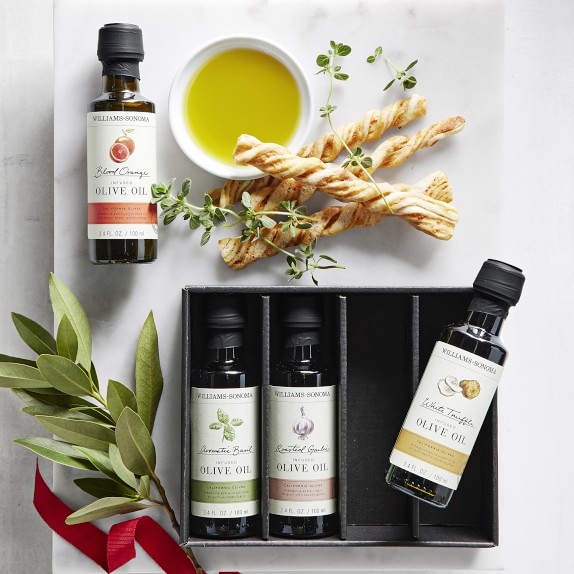 A curated selection of rare Italian olive oils from Williams-Sonoma, each housed in beautifully designed bottles, capturing the essence of terroir in every drop.