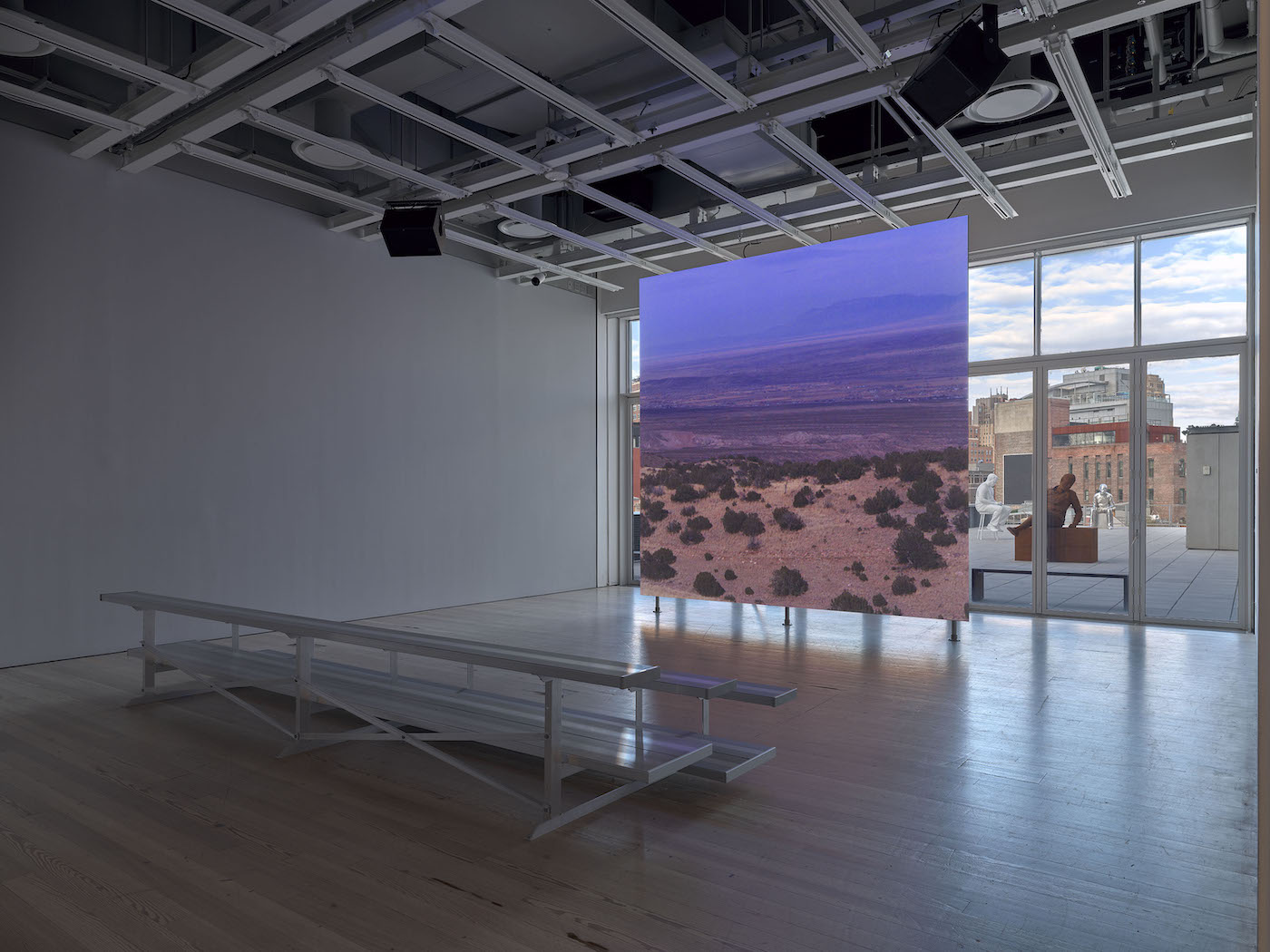 Installation view of Whitney Biennial 2022: Quiet as It’s Kept (Whitney Museum of American Art, New York, April 6- September 5, 2022). Lucy Raven, Demolition of a Wall (Album 1), 2022. Photograph by Ron Amstutz. Installation view of Whitney Biennial 2022: Quiet as It’s Kept (Whitney Museum of American Art, New York, April 6- September 5, 2022). Lucy Raven, Demolition of a Wall (Album 1), 2022. Photograph by Ron Amstutz.