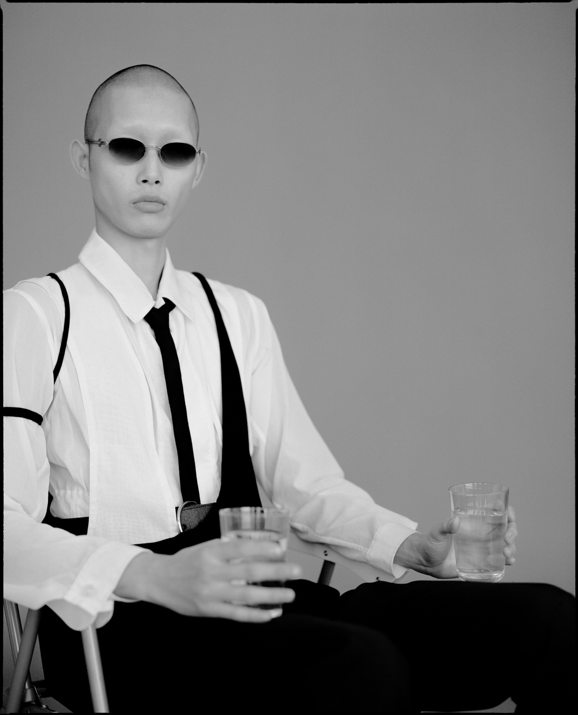 tank by HELMUT LANG, shirt by LOEWE, pants and tie by DIOR HOMME sunglasses by GENERAL EYEWEAR, shoes by DUMITRASCU