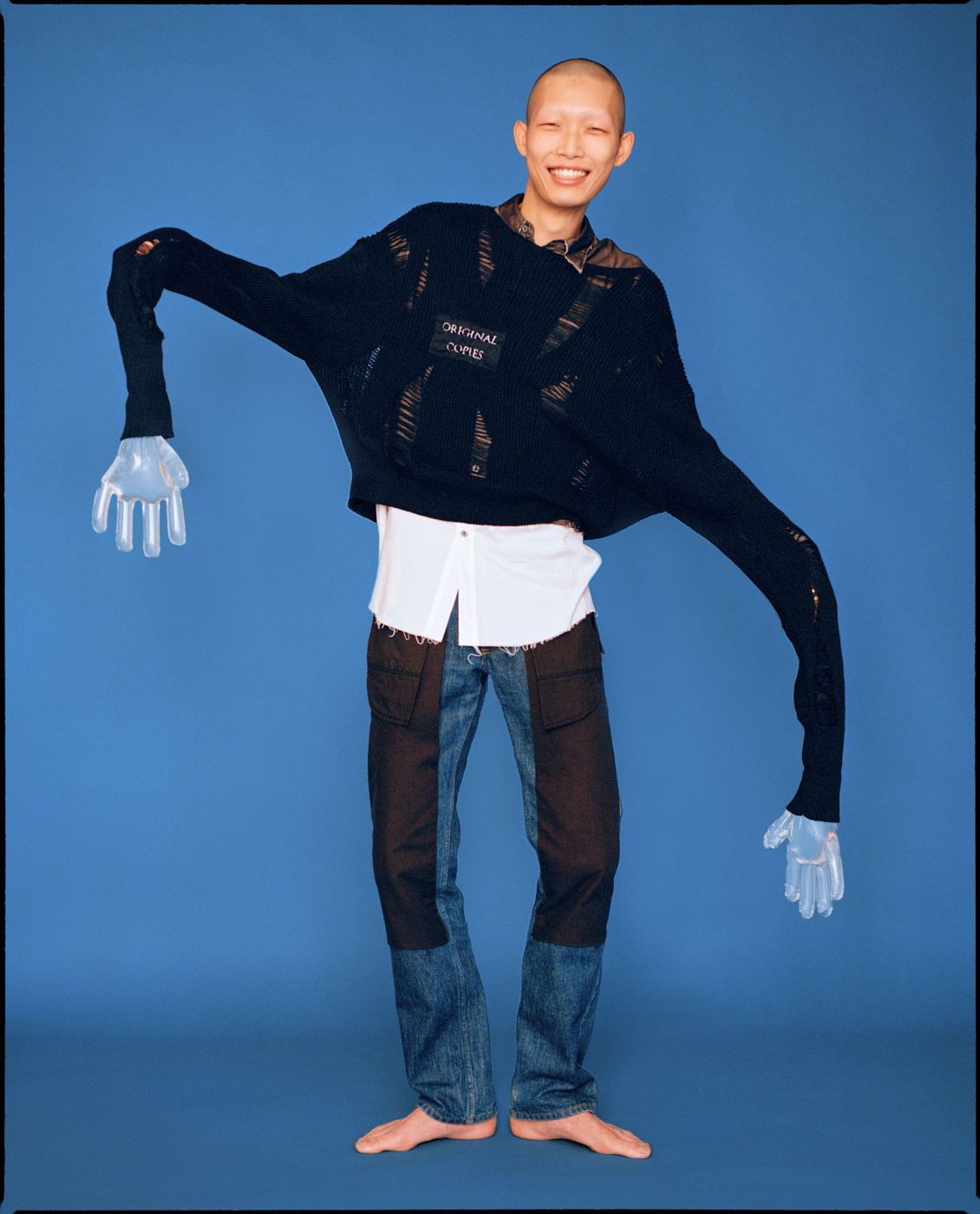Xu Meen wears sweater and shirt by CHRISTIAN DADA, jeans by HELMUT LANG Xu Meen editorial