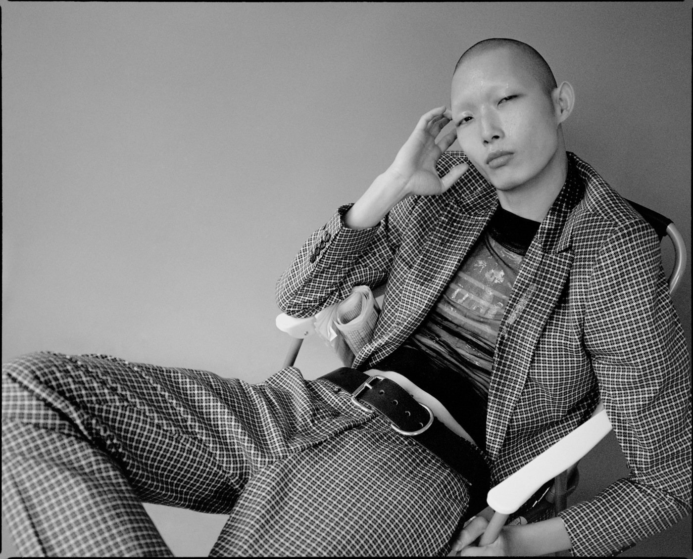 suit by TIGER OF SWEDEN top by JEAN PAUL GAULTIER belt (throughout) stylist’s own